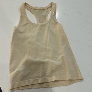Light yellow lululemon swiftly tank top - size 4/small